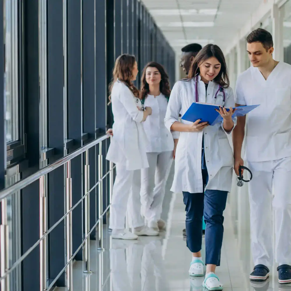 A team of specialist doctors in a hospital corridor